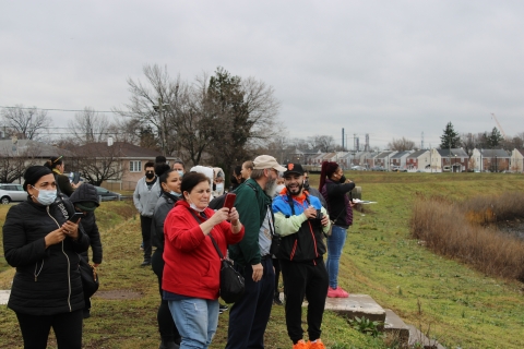 Participants in the Elizabeth Urban Wildlife Refuge Partnership Great Backyard Bird Count Search for birds along the Elizabeth River Trail