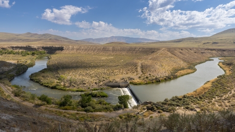 Overlooking the Great Basin sagebrush landscape featuring the Truckee River flowing through a riparian area.