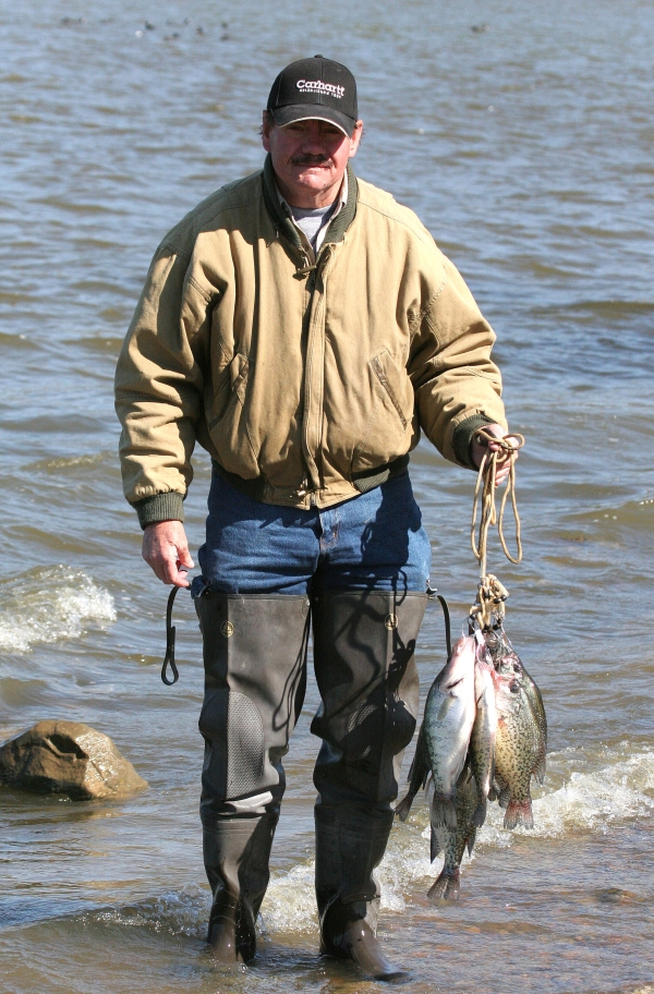 An image of a person holding their fish catch for the day.