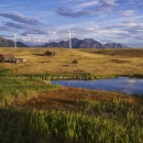 Landscape photo of Rocky Flats showing a pond, Lindsay Ranch, and the flatirons