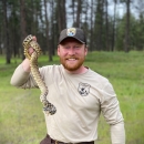 Thurman Johnson holding a gopher snake