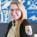 A portrait of a woman in a U.S. Fish and Wildlife Service uniform