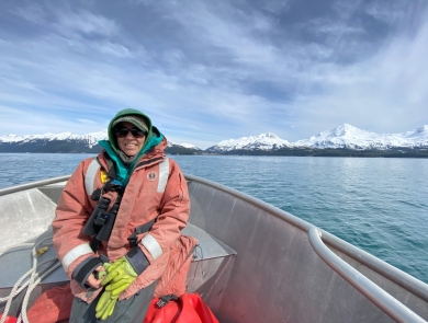 Monica Iglecia in a boat on Copper River Delta