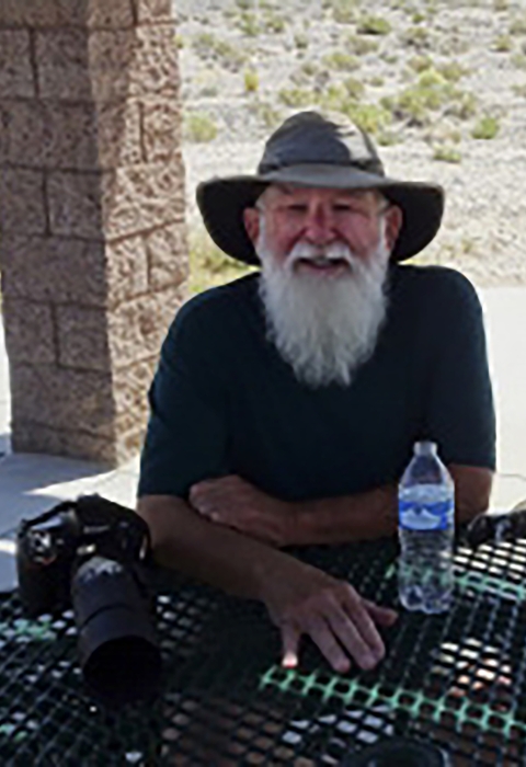 Man with white beard and hat