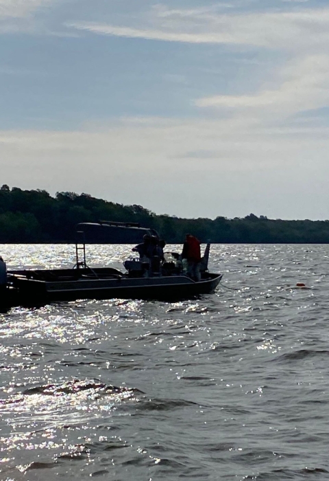 Silhouette of a boat on a lake