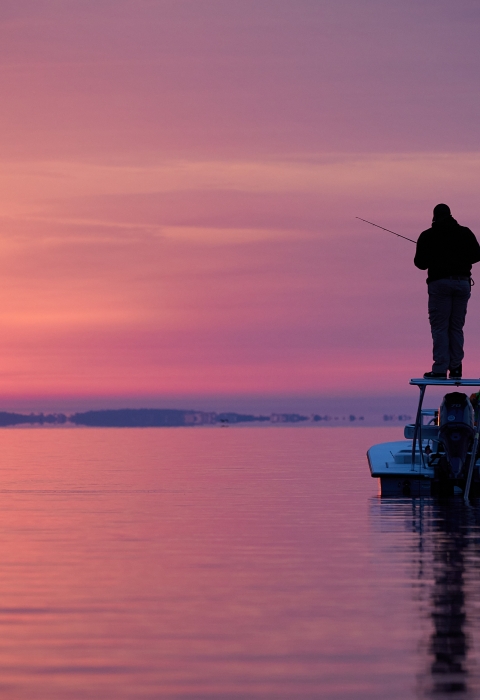 Sunset fishing on a boat