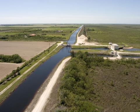 Stream channel running straight across a flat, Florida landscape