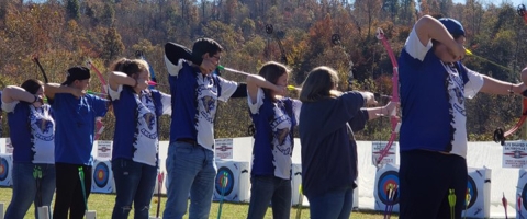 archers on the firing line shooting at targets