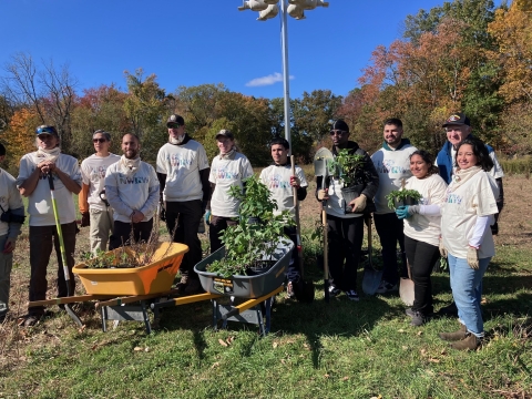 Group photo of participants at a refuge planting event