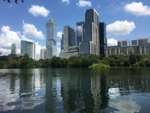 Tall buildings behind a body of water