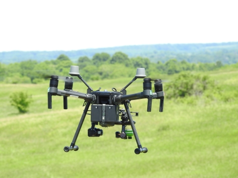 A UAS (unpiloted aircraft system) gathers multispectral imagery used to model microclimate anomalies in Wisconsin grasslands.