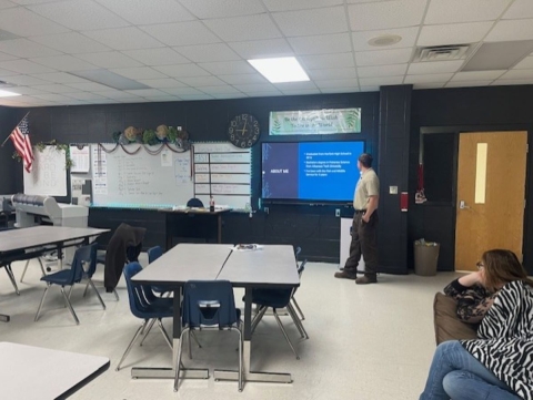 Fish Biologist Creed Chapman gives a presentation to a local highschool.