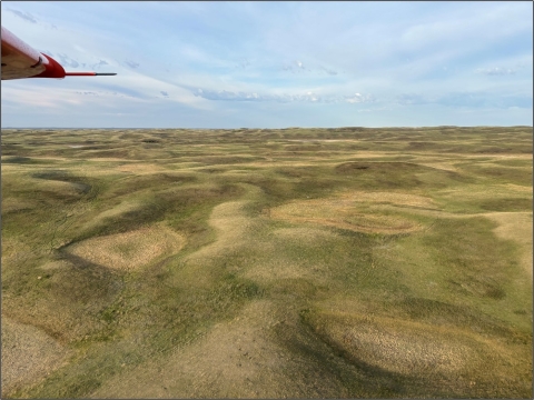 aerial view of a hilly and dry landscape