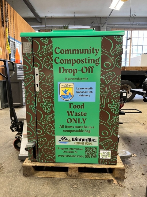 a green and brown metal container reads "communtiy composting drop-off"