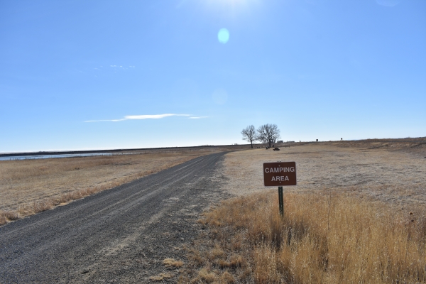 Camping area at Maxwell National Wildlife Refuge Brown sign says "CAMPING AREA"