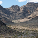 Mountains rising sharply up from the desert floor