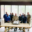 Nine agency leaders gather to celebrate signed agreement.