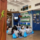 Kids looking at a video on the "Kids Corner" at Santa Ana National Wildlife Refuge.