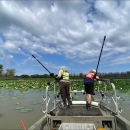 Two employees on a boat