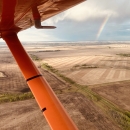 aerial view of a rainbow over the landscape