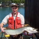 Michael Goehle holding large musky