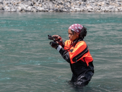 USFWS digital media intern, Typhanie Shepherd, capturing video footage of fiel