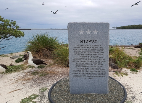 A granite monument honoring the armed forces that defended Midway from the Japanese on June 4-7, 1942