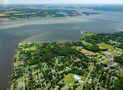 Aerial view of a river flowing past a town