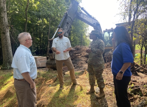 U.S. fisha dn wildlife staff talk with Fort Meade's Colonel Gore about stream restorationists Ben Hutzell speak with Colonel Gore and ARD Sharon Marino about stream restoration techniques