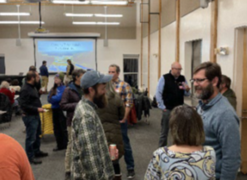 Community participants talking at "Meet Your Marsh!" meeting.