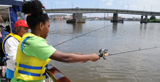 Young person fishing, Anacosta River, Washington, D.C. 