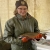 Biological science technician Rebekah holding a brook trout