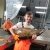 Biologist Alex Jones holding a large fish at Coleman Hatchery