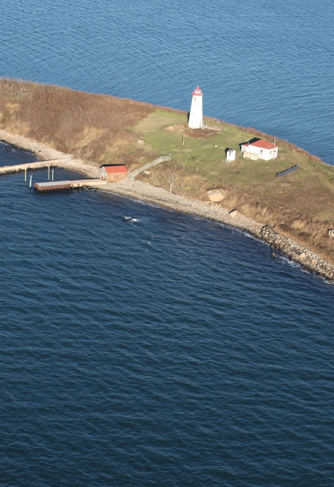 An aerial view of Falkner Island, lighthouse, and building, in CT