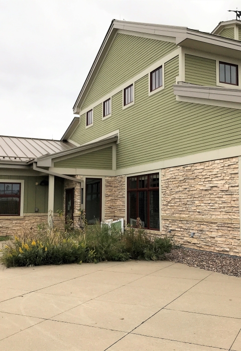 Visitor at the La Crosse District showing bird tape dots on windows