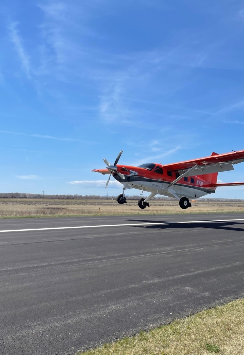 airplane coming in to land on a runway