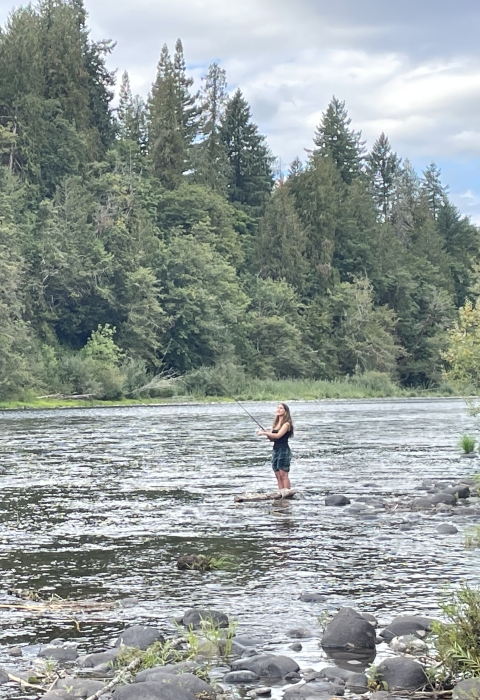 A Rosemary Anderson High School Student fishes on Oregon's Clackamas River. 