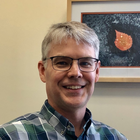 Close up of a man with glasses