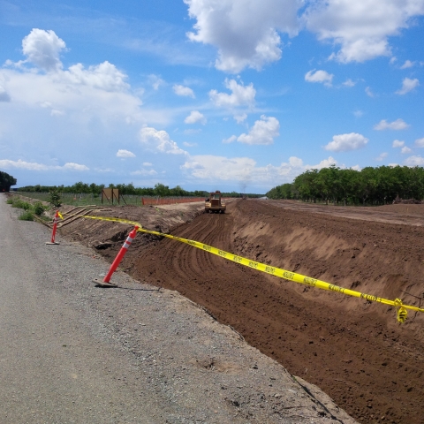 A newly created levee separates the Sacramento River from a new floodplain