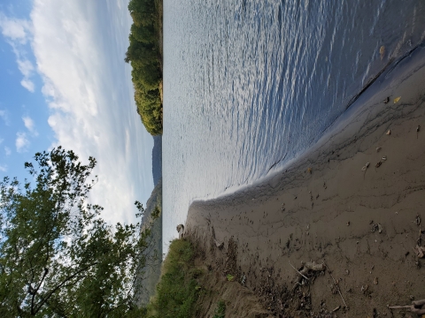 A view of Manchester 2 Island from a beach shoreline on Manchester 1 Island