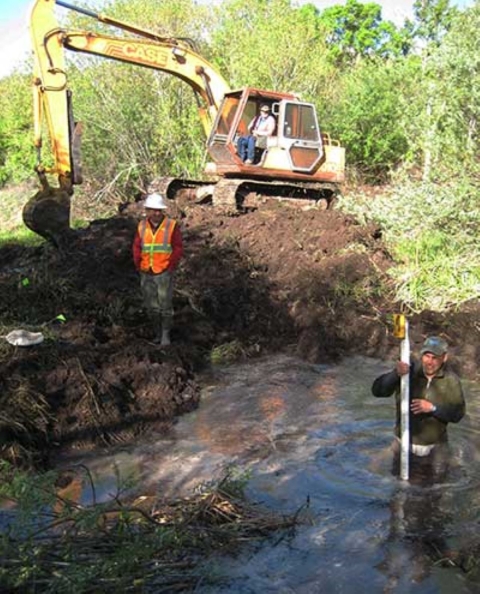 Biologist Angel Montoya is pictured standing waist deep in the waters of Moreno Spring.