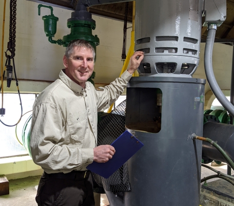 Steve Baum checks out a water pump at Makah National Fish Hatchery