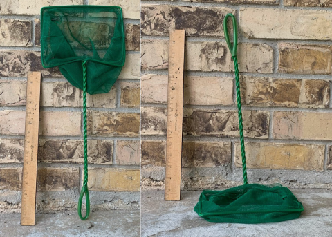green nets propped up against a brick wall next to a ruler showing the handle to be about 16 inches long.