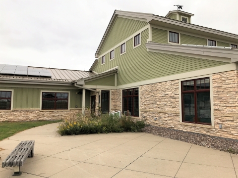 Visitor at the La Crosse District showing bird tape dots on windows