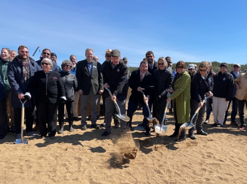 A group of people with shovels 