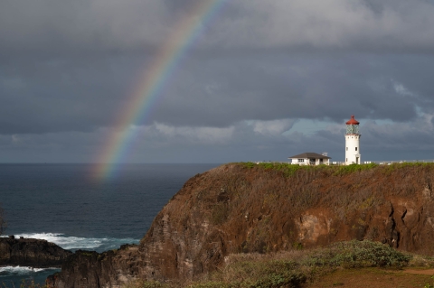 A rainbow is visible over Kīlauea Point Lighthouse, part of Kīlauea Point National Wildlife Refuge by Laurel Smith/USFWS