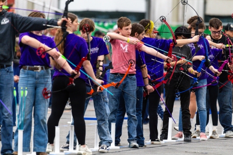 student archers on the shooting line
