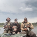 3 people holding ducks