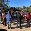 Group photo discussing safety protocols.