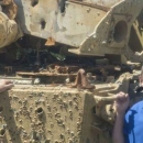 A tank littered with bullet holes at Townsend bombing range.